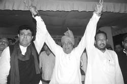 Former Chief Minister Om Prakash Chautala with party candidates Yograj Singh (left) and Pradeep Chaudhary from Panchkula and Kalka assembly constituencies, respectively, during a rally at Panchkula on Thursday.