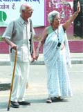 Senior citizens cross road at Jantar Mantar in New Delhi on Thursday