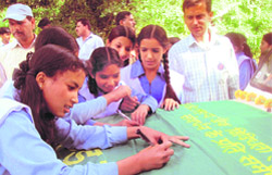 Students sign a banner at Askot sanctuary during Wildlife Week
