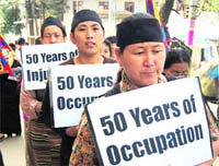 Tibetans protest against Chinese policies at McLeodganj on Thursday.