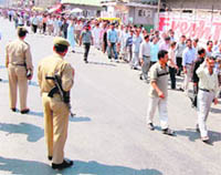 SRTC employees take out a protest rally in Srinagar on Thursday.
