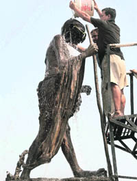 The statue of the Father of the Nation being washed on the eve of Gandhi Jayanti at Satwari Chowk in Jammu on Thursday.