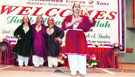 Girls present a cultural item during a book release function in Srinagar on Thursday. 