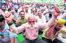 PSEB employees and engineers hold a rally at PSEB zonal headquarters in Ludhiana on Thursday.