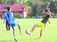 Players in action during a match between Doon Star and Cantt Blues at the Ram Bahadur Chettri Memorial One-Day Football Tournament in Dehradun on Friday.