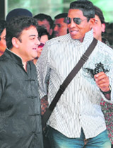 Jermaine Jackson (R), elder brother of the late King of Pop Michael Jackson, interacts with musician Adnan Sami on his arrival at the Mumbai airport 