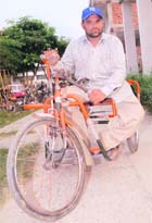 Vir Chand, a differently abled resident, who has not received his pension since March, in Jalandhar. 