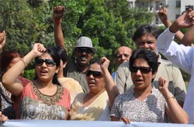 Residents and RWA members of Sushant Lok-I, Block-C, protest against the construction of a dispensary on a plot meant for a park in Gurgaon on Saturday
