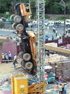 Two cranes overturned at a Metro construction site in Said-ul-Ajaib area of New Delhi on Saturday. 