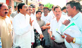 CM Ramesh Pokhriyal Nishank talks to officers during an inspection of development works for the Maha Kumbh in Haridwar on Saturday.