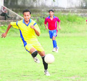 A match in progress between Sports College (red) and Cantt Blue (yellow) in Dehradun on Saturday. 