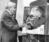 UN General Assembly president Ali Abdussalam Treki unveils a stamp of Mahatma Gandhi during a function to mark his birth anniversary in New York