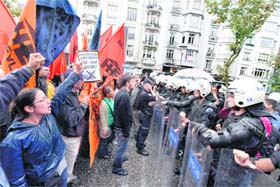Protesters shout slogans against the International Monetary Fund at a rally in Istanbul