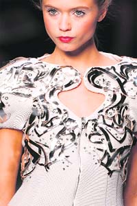 A model presents a creation by German designer Karl Lagerfeld as part of his Spring/Summer 2010 collection at the Paris Fashion Week