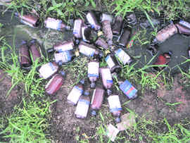 Empty bottles bottles of intoxicants disposed on the Boparai-Guru Teg Bahadur road at Doraha.
