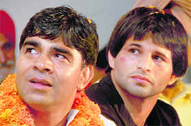 Ramesh Kumar (R) with his coach Rohtas Dahiya in Zirakpur on Sunday.