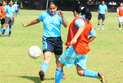 Players try to take hold of the ball during a game in Chandigarh