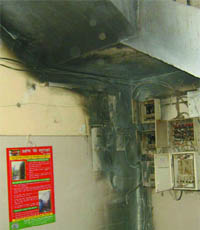 Smoke billows out from the electric box of a Municipal Corporation of Delhi school that caught fire at Baprola village near Najafgarh in New Delhi on Monday.