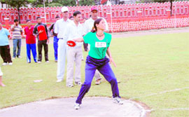 A woman discus thrower at the Police Athletic Meet at Police Lines in Dehradun on Monday.