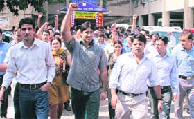 Junior doctors hold a protest outside the GMCH in Jammu