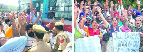 Members of the J&K Housing Board Employees Association protest at Gandhi Nagar in Jammu