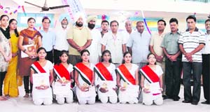 Students of the winning team of National Anthem singing competition held at Jagraon, along with chief guest and organisers