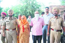 Shiv Saranjit Singh and Amarjit Kaur in police custody on charges of possessing 1.2 kg smack in Ludhiana on Monday.