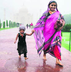 A woman and her daughter outside Taj Mahal in Agra on Monday.