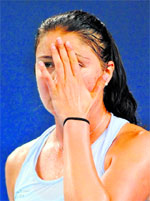 Top seed Dinara Safina reacts after losing a point against Zhang Shuai at the China Open in Beijing on Monday.