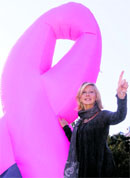 Australian singer and actress Olivia Newton-John poses to promote the Pink Ribbon breast cancer campaign in Vienna on Monday.