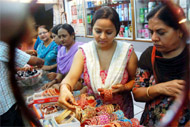 A day before Karva Chauth, women selecting bangles at a shop in Dhobi Bazaar in Bathinda
