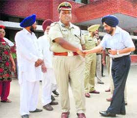 Civil and police administration officials (from right) Deputy Commissioner PS Mand, DIG (Patiala range) SK Asthana, SSP (Mohali) GPS Bhullar and SDM Raghbir Khera wait for Deputy Chief Minister Sukhbir Badal at the district courts in Mohali