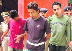 The accused being taken to a court in Chandigarh