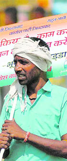  A Cogress supporter campaigns for the party in Karnal.