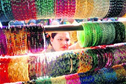 A woman looking for bangles on Karva Chauth at Shimla on Tuesday.