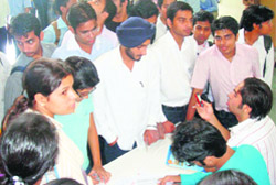 Students collect hall tickets to appear for a recruitment drive at RIMT in Mandi Gobindgarh