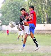 A match of the Dehradun District Football Super League in progress on Wednesday. 