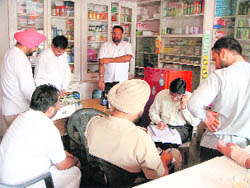 Health department officials raid a chemist shop at Doraha on Wednesday.
