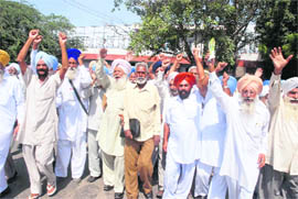 Members of the PRTC Pensioners Association hold a protest in support of their demands in Bathinda on Wednesday. 