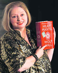 Author Hilary Mantel poses with her book 'Wolf Hall' after winning the 2009 Man Booker Prize for Fiction in London.