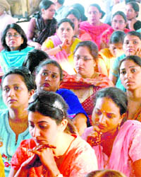 Chandigarh contractual teachers sit on a dharna on the 100th day of their hunger strike in Chandigarh on Thursday.