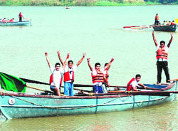 Winners of the boat-pulling race celebrate their victory at Sukhna Lake in Chandigarh on Thursday.