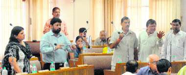 Councillors protest during the house meeting in Chandigarh on Thursday.