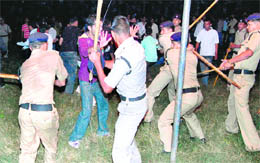 Policemen rain lathis on members of the audience in Haridwar on Wednesday night.
