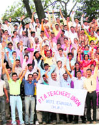 PTA teachers hold protest at Dharamsala on Thursday.