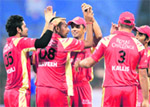 Praveen Kumar (2nd from left) celebrates with team mates after taking the wicket of Cape Cobras Herchelle Gibbs