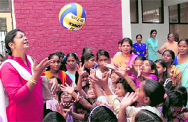 Members of the Air Force Wives Welfare Association interact with inmates of Snehomoyee orphanage after donating items of daily use in Chandigarh on Friday.