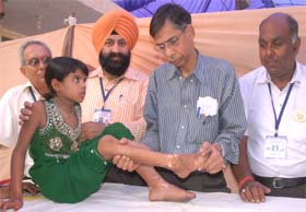 Doctors examine disabled children at the polio corrective surgical camp in Jalandhar