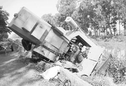 A combine stuck on the edge of a canal at Doraha