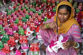 An artist busy making diyas ahead of the festival of lights in Bathinda